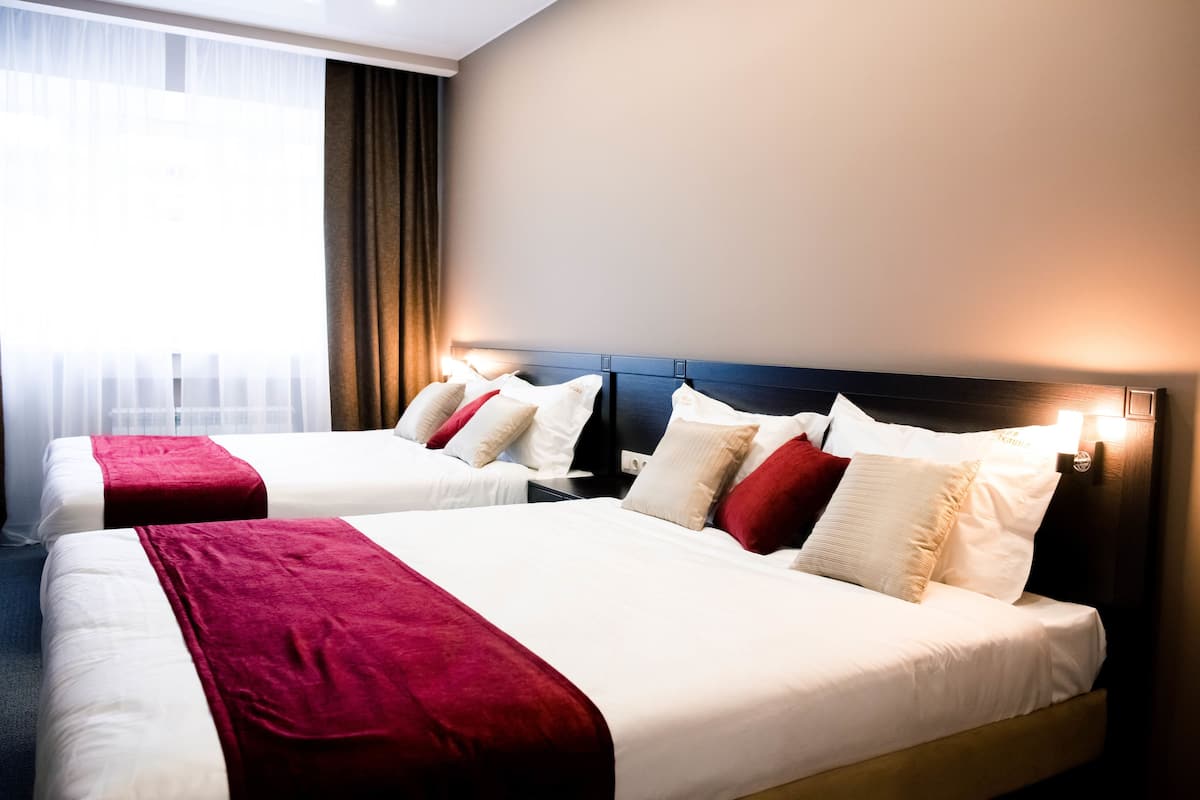 Room, 2 Double Beds | In-room safe, desk, blackout curtains, iron/ironing board
