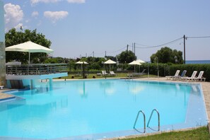 Seasonal outdoor pool, open 9 AM to 7 PM, pool umbrellas, sun loungers