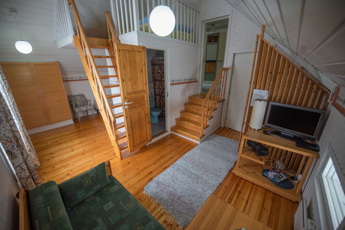 Family Condo, 1 Bedroom, Courtyard View | Living area | Flat-screen TV, heated floors
