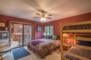 A cozy bedroom with a bed, a ceiling fan, a window, and a view of the outdoors. - Serventi 3 Bedroom Holiday Home By Tahoe Truckee (Truckee)