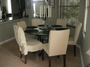 Enjoy meals in this inviting dining area with a round table and six comfortable chairs.