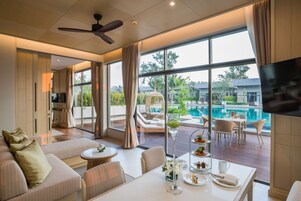 AVANI Two Bedroom Lagoon Pool Villa | Living area | 42-inch LED TV with cable channels, TV, fireplace