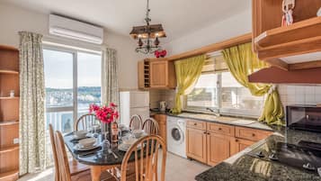 Family Apartment, 2 Bedrooms, Terrace, Sea View | Private kitchen | Fridge, microwave, oven, stovetop