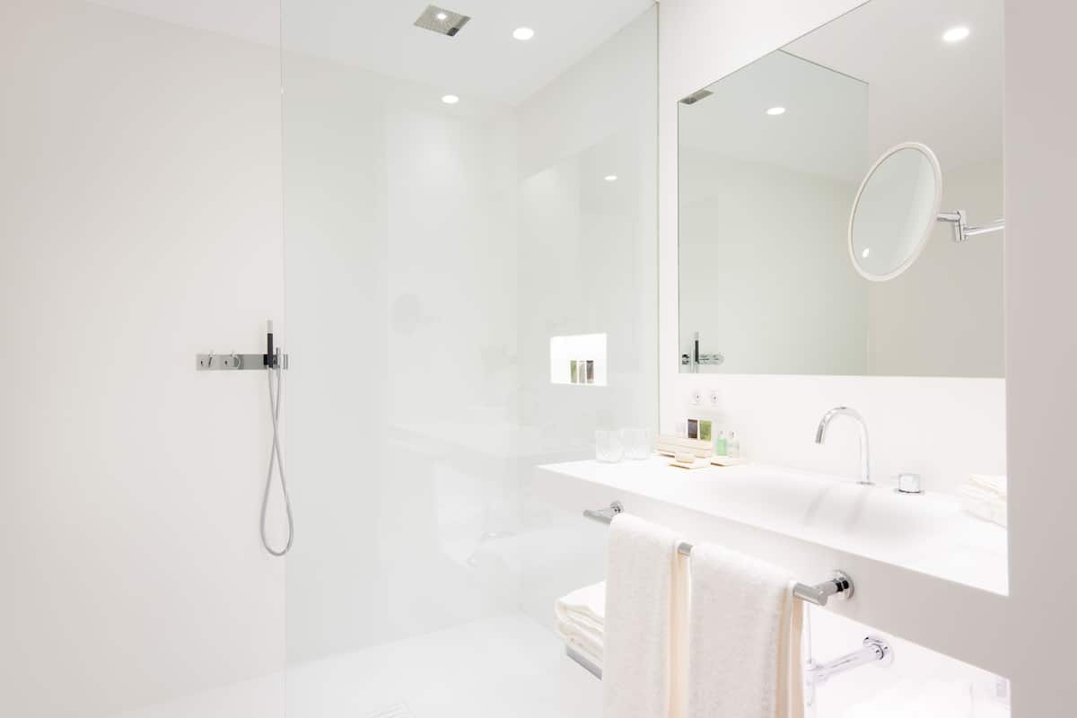 junior suite | bathroom | designer toiletries, hair dryer, bathrobes, slippers