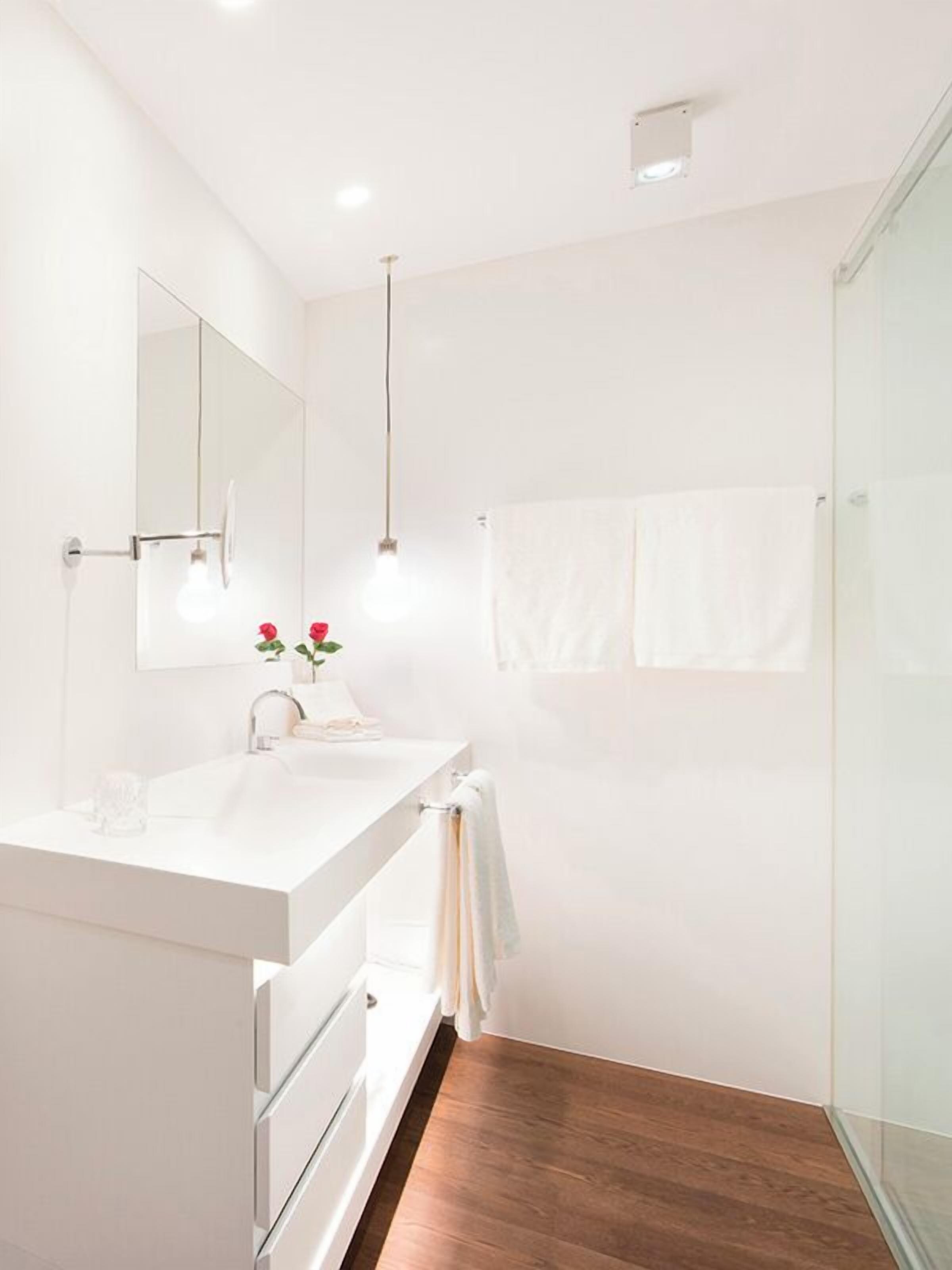 deluxe | bathroom | designer toiletries, hair dryer, bathrobes, slippers