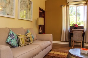 Apartment with Balcony ADVENTURE | Living area | Flat-screen TV