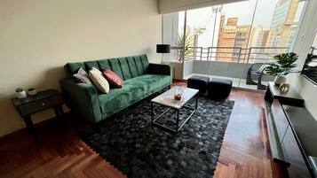 Business Apartment, 4 Bedrooms | Living area | 32-inch LED TV with cable channels, TV