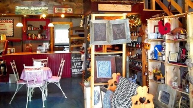 A cozy, eclectic interior with a bar area, seating, and various decorative items. - Heritage Inn (Richfield Springs)