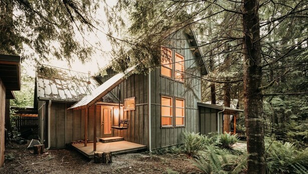 A rustic cabin with a wooden exterior, a porch, and a small deck. - 70mbr- Hot Tub - Bbq - Wi-fi - Pets Ok - Sleeps 8 3 Bedroom Home by RedAwning (Deming)