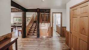 A wooden staircase leading to a second floor, a wooden floor, and a wooden door. - 03mbh -12-bdrm - 3.5-bath - Wifi - Pets Ok - Sleeps 26 12 Bedroom Home by RedAwning (Deming)