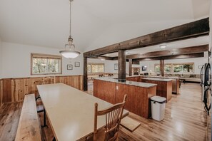Enjoy meals together at the large dining table with benches.