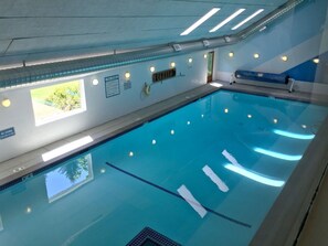 Swimmers can enjoy the pool with clear lane markings and a tiled floor.
