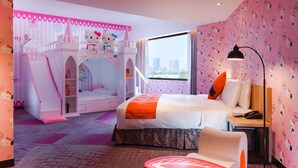 A pink-themed hotel room with a Hello Kitty playhouse, a bed with an orange blanket, and a city view through the window. - HOYA Resort Hotel Kaohsiung (Kaohsiung)