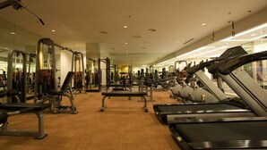 A gym with treadmills, weight machines, and free weights. - Imperial Palace Hotel (Miri)