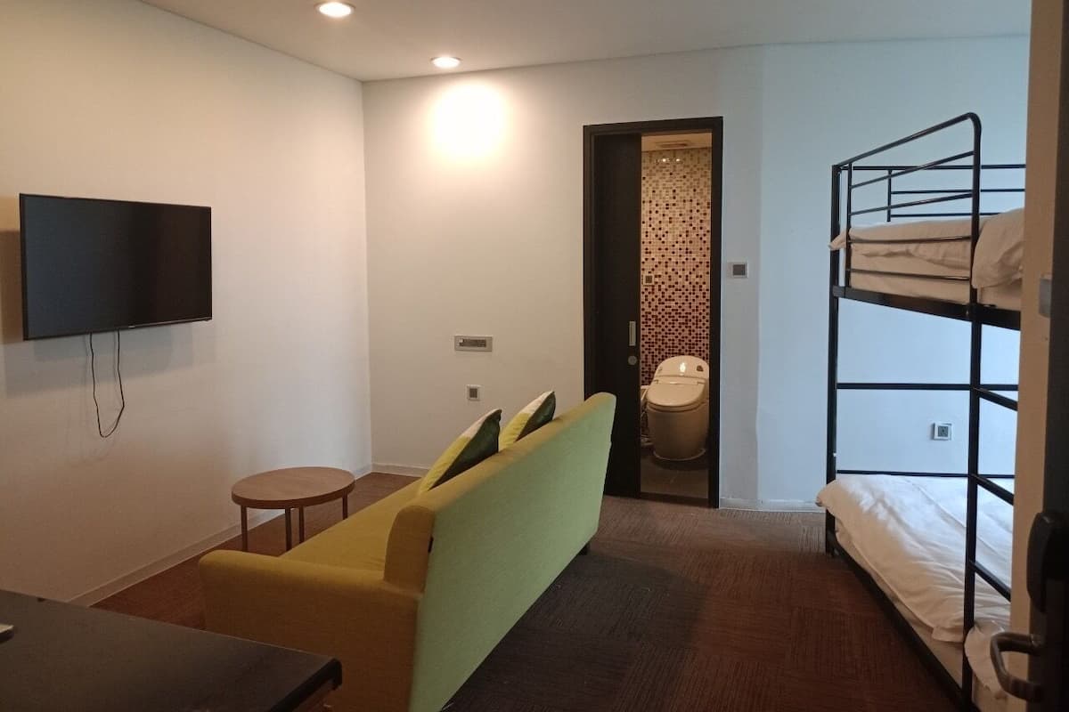 Shared Dormitory, 4 Bedrooms | Living area | Flat-screen TV
