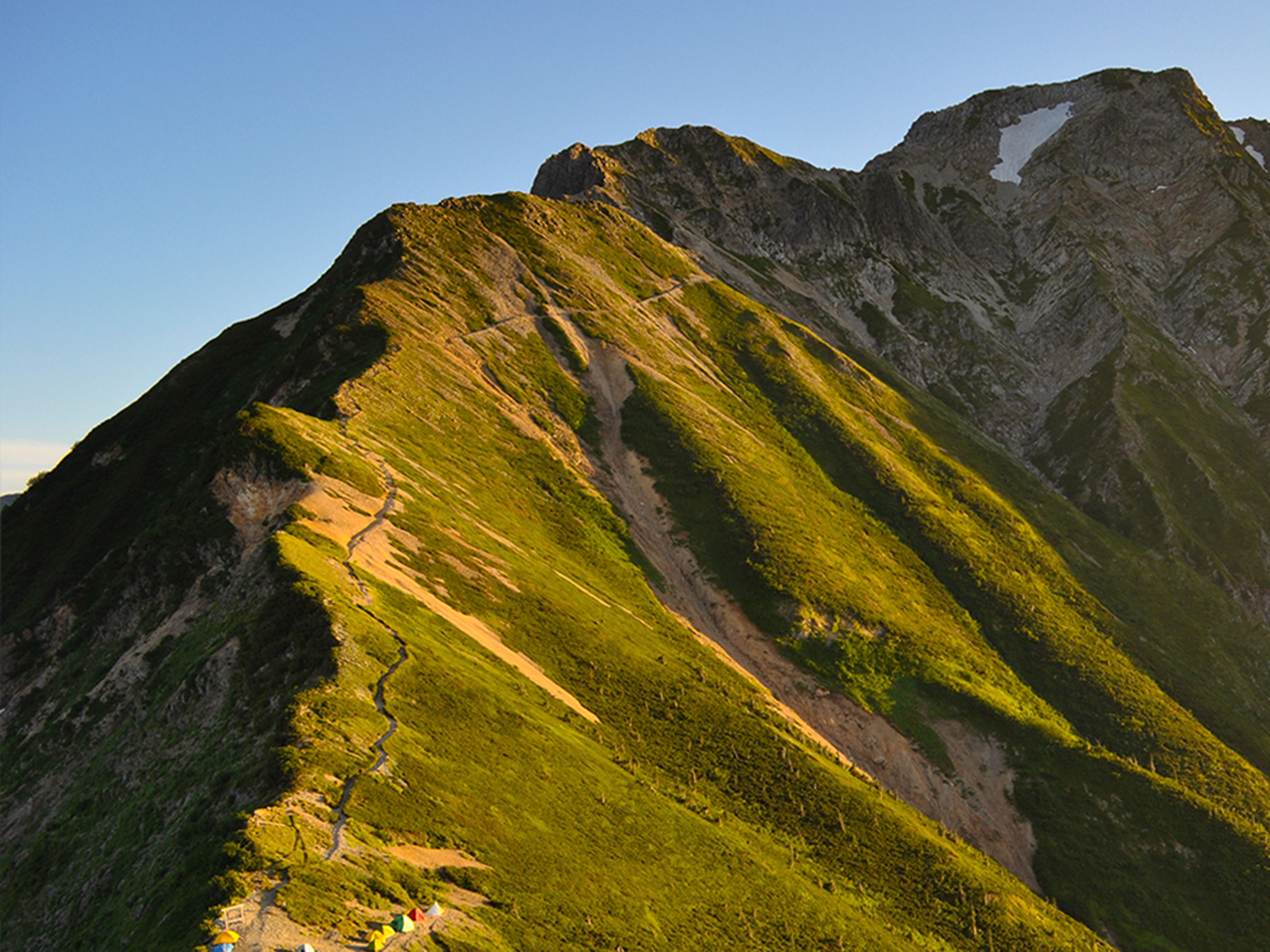 A mountain with a clear sky.