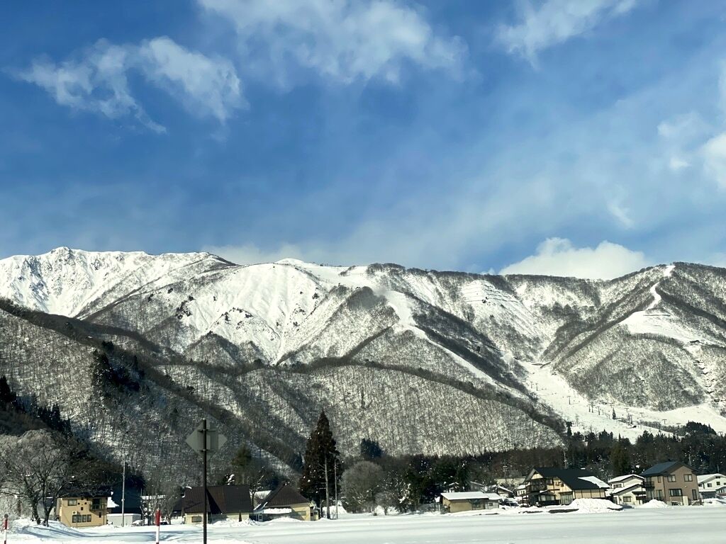 A snow-covered mountain landscape with a clear sky.