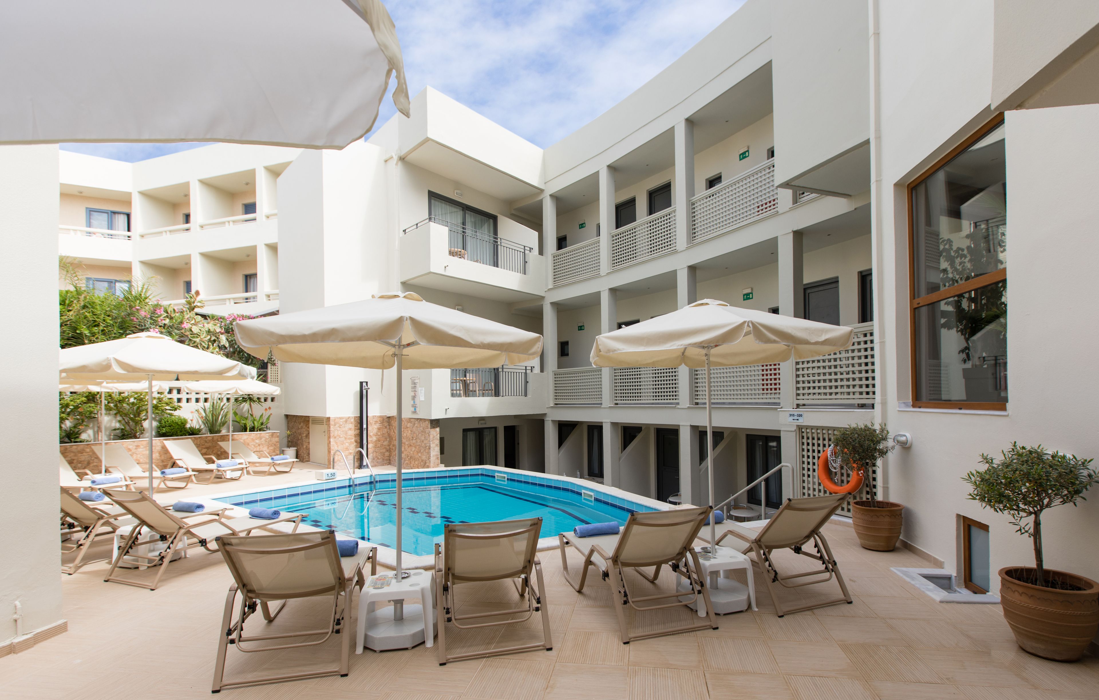 outdoor pool, pool umbrellas, pool loungers