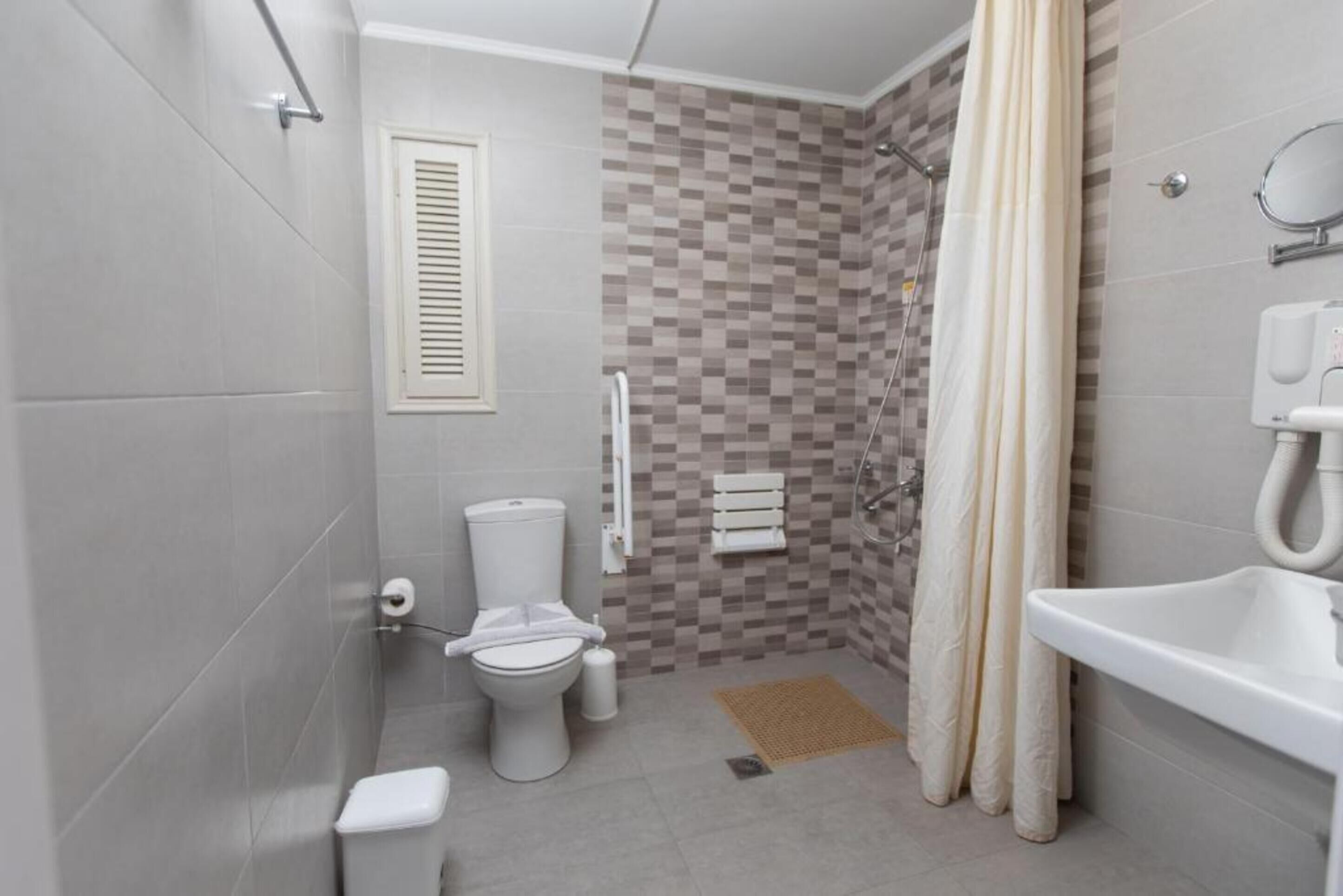 triple room pool view | bathroom | shower, free toiletries, hair dryer, bathrobes