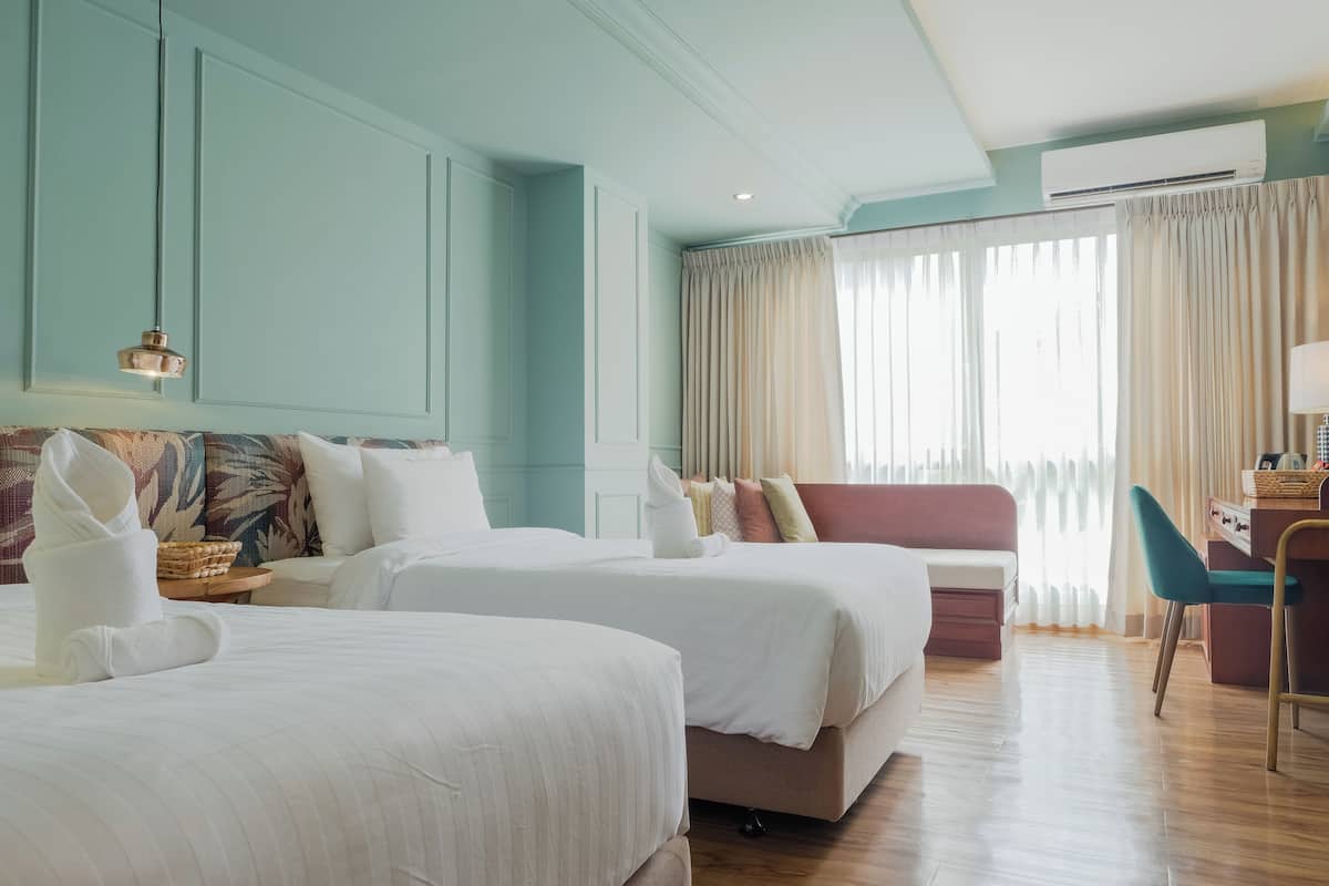 Deluxe Twin Room | Free minibar, desk, laptop workspace, blackout drapes
