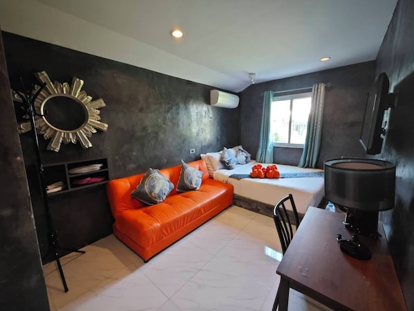 Deluxe Room, Garden View | Minibar, in-room safe, desk, free WiFi
