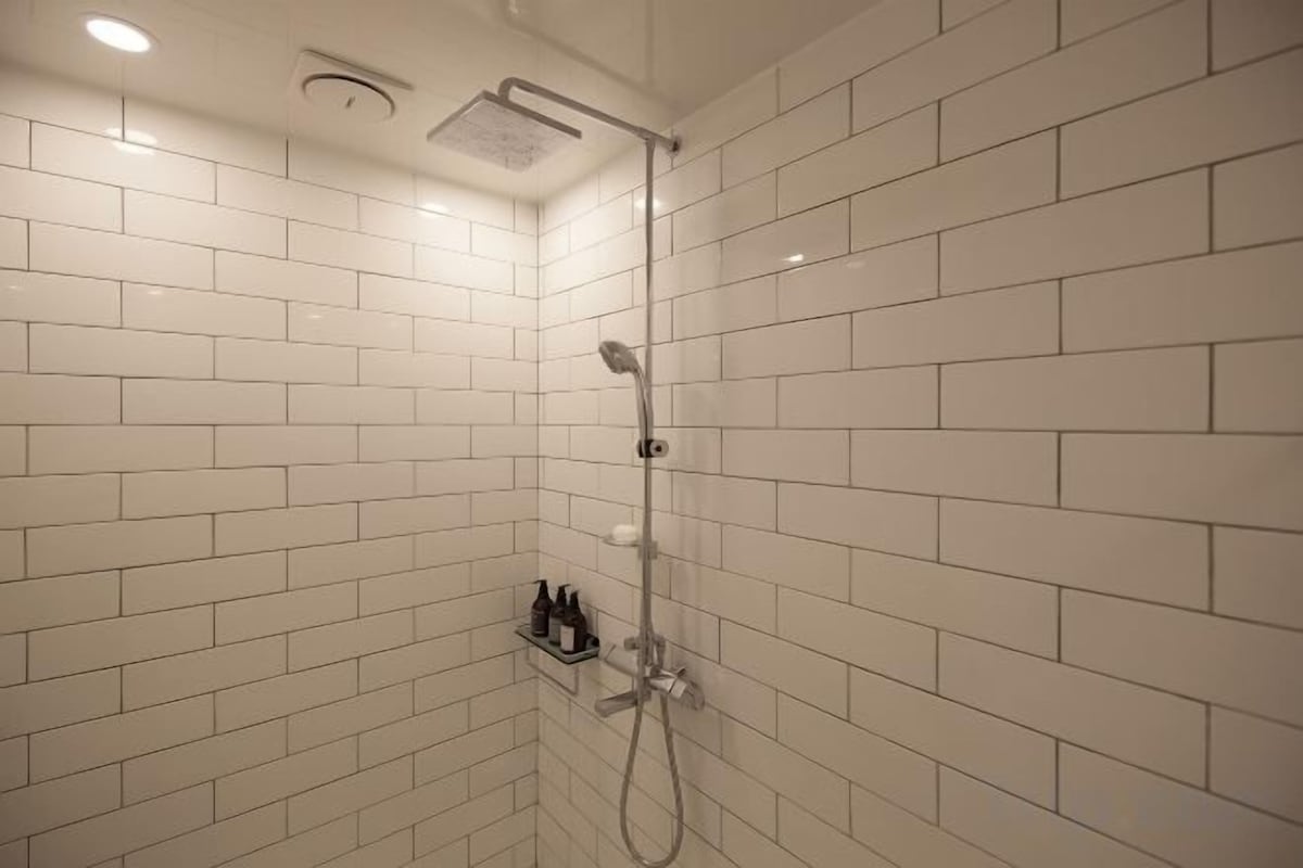 Bathroom | Shower, free toiletries, hair dryer, slippers