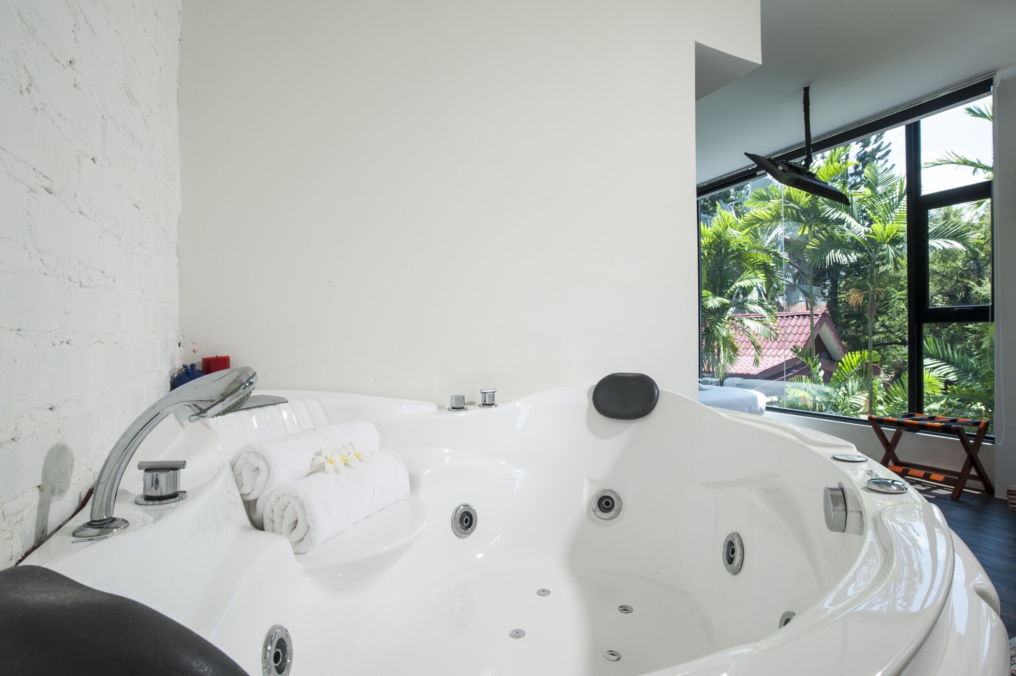 garden suite with bath tub | in-room safe, desk, iron/ironing board, free wifi