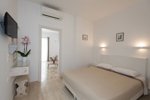Deluxe Suite, Sea View | Minibar, in-room safe, desk, soundproofing