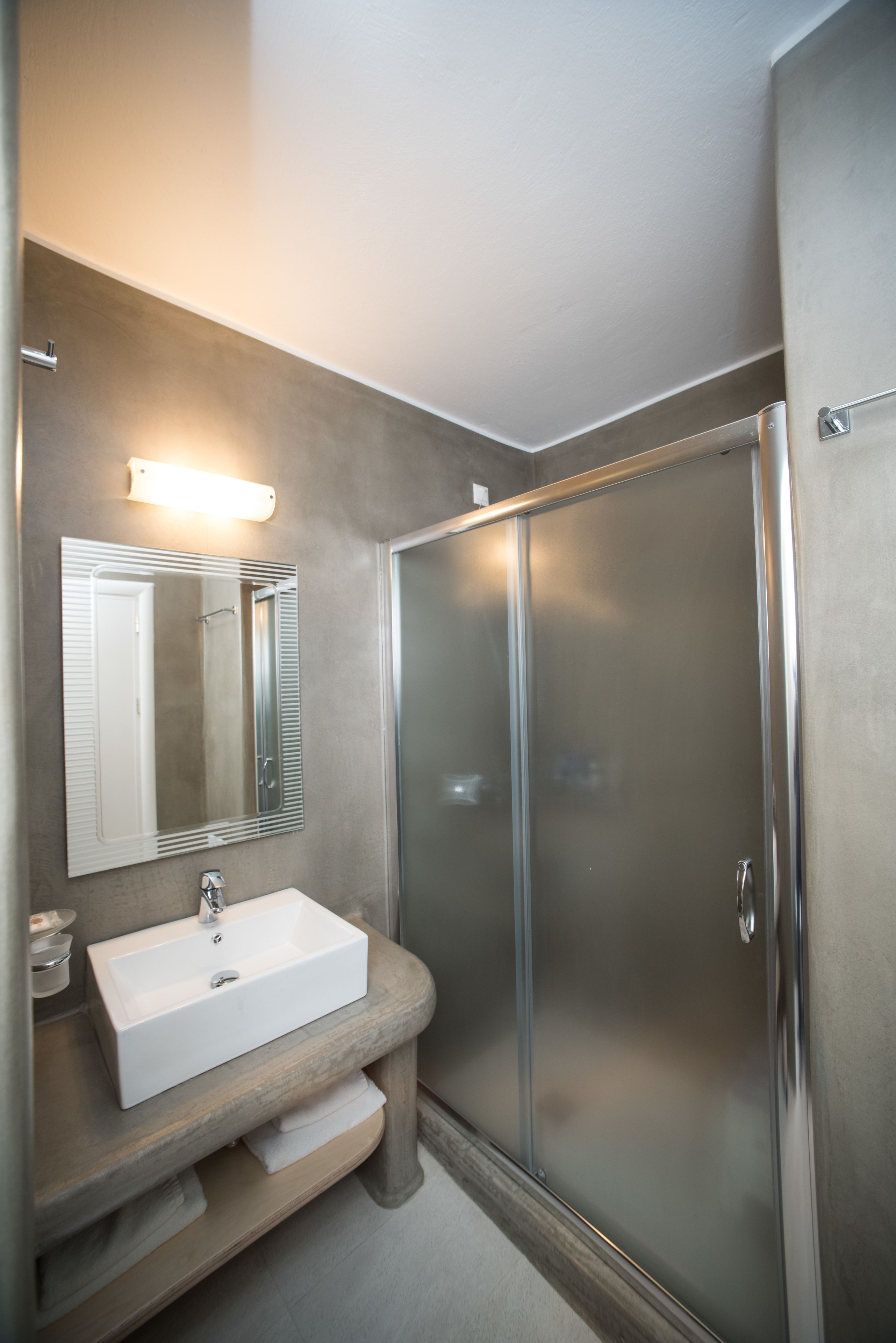 economy double room | bathroom | shower, eco-friendly toiletries, hair dryer, towels