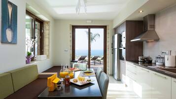 Fridge, stovetop, electric kettle, cookware/dishes/utensils