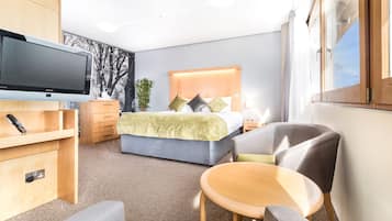 Desk, iron/ironing board, bed sheets