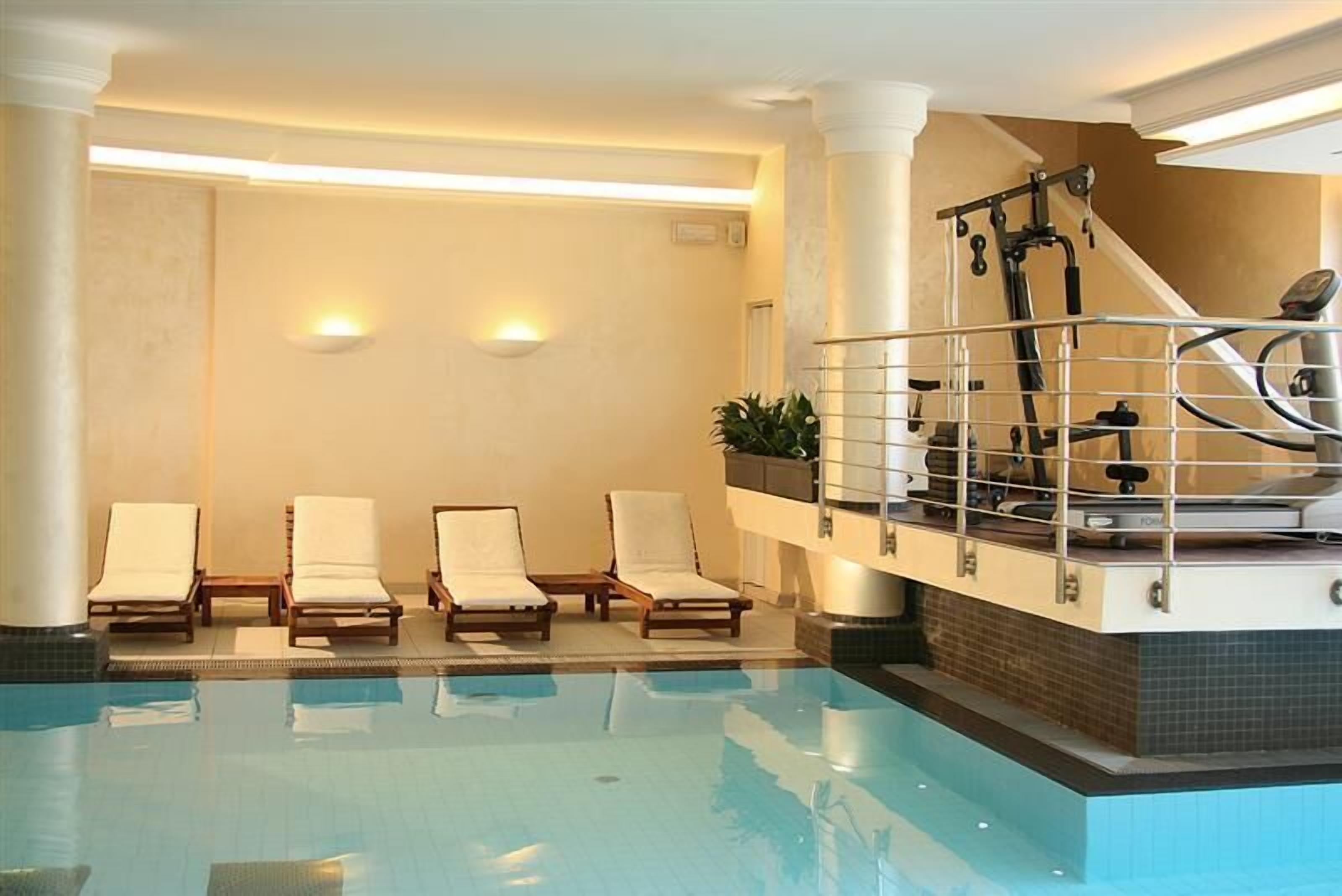indoor pool, outdoor pool, pool loungers