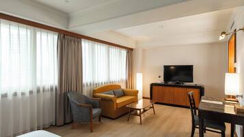 Deluxe Double Room | Living area | LCD TV