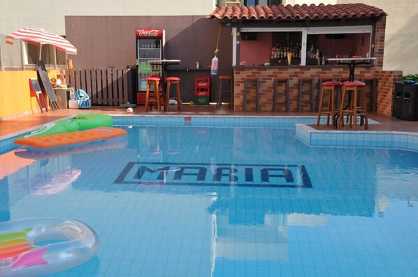 Seasonal outdoor pool, pool umbrellas, pool loungers