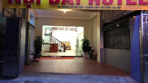 The entrance of Noi Bai Hotel with a visible staircase leading inside. - Noi Bai Hotel (Hanoi)