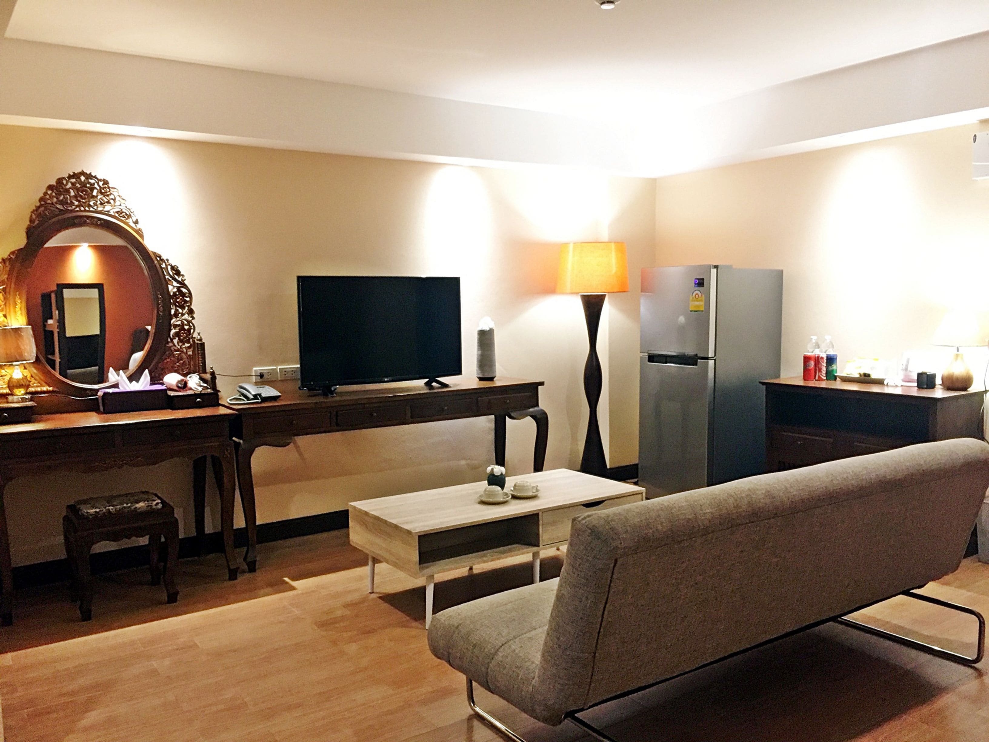 suite with two double beds | living area | flat-screen tv