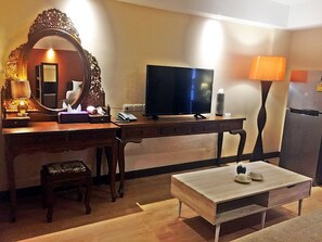 Suite with Two Double Beds | Living area | Flat-screen TV