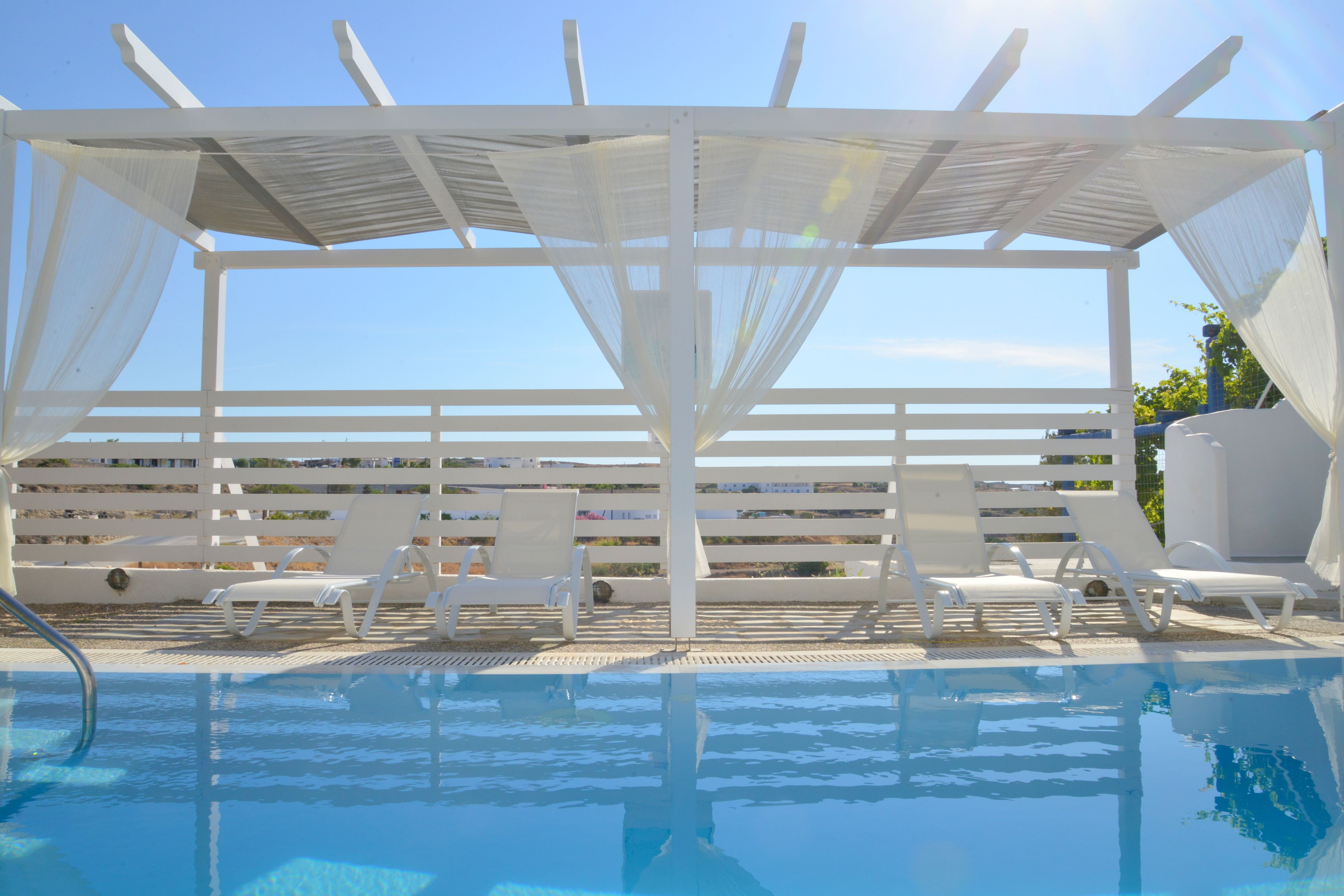 outdoor pool, pool umbrellas, pool loungers