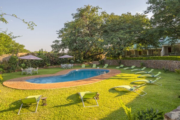 2 outdoor pools, pool umbrellas, pool loungers