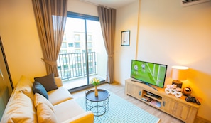 1 Bedroom Apartment, Pool View | Living area | 40-inch flat-screen TV with cable channels, TV, DVD player