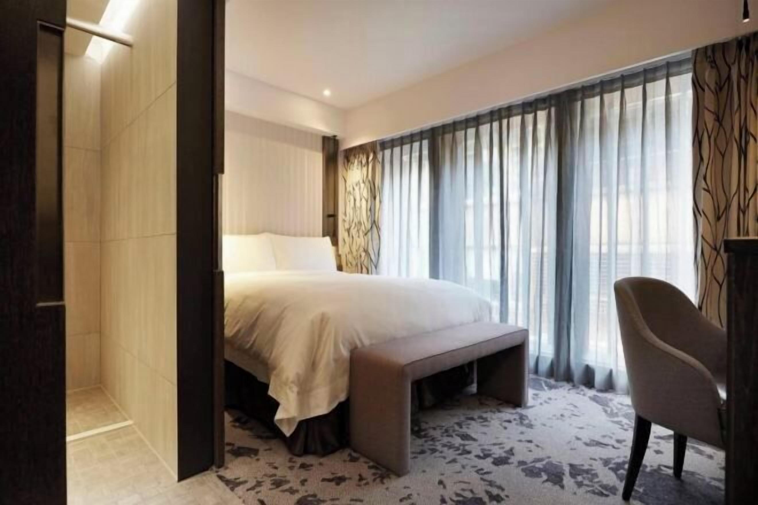 Premium bedding, down comforters, pillowtop beds, in-room safe