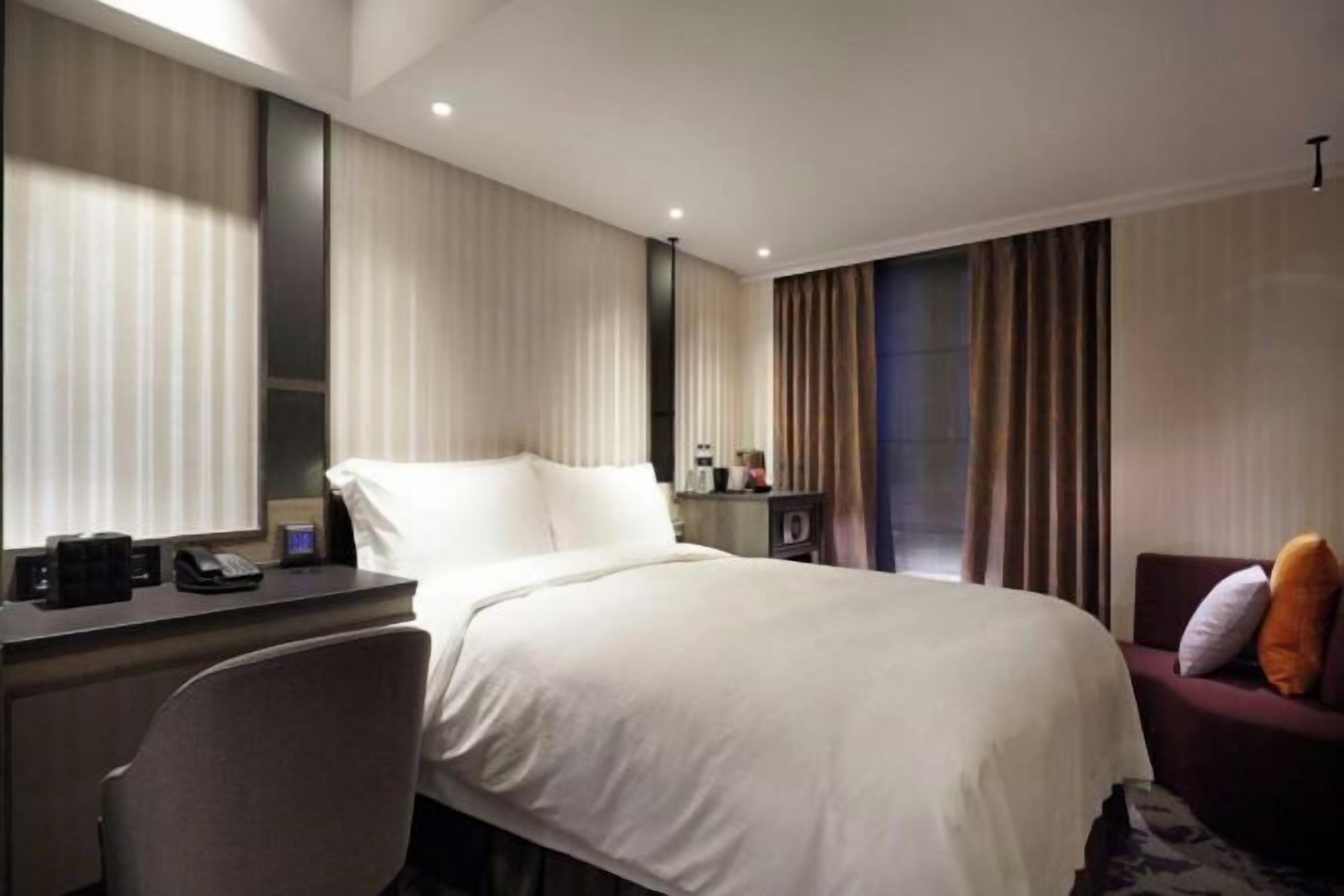 Premium bedding, down comforters, pillowtop beds, in-room safe