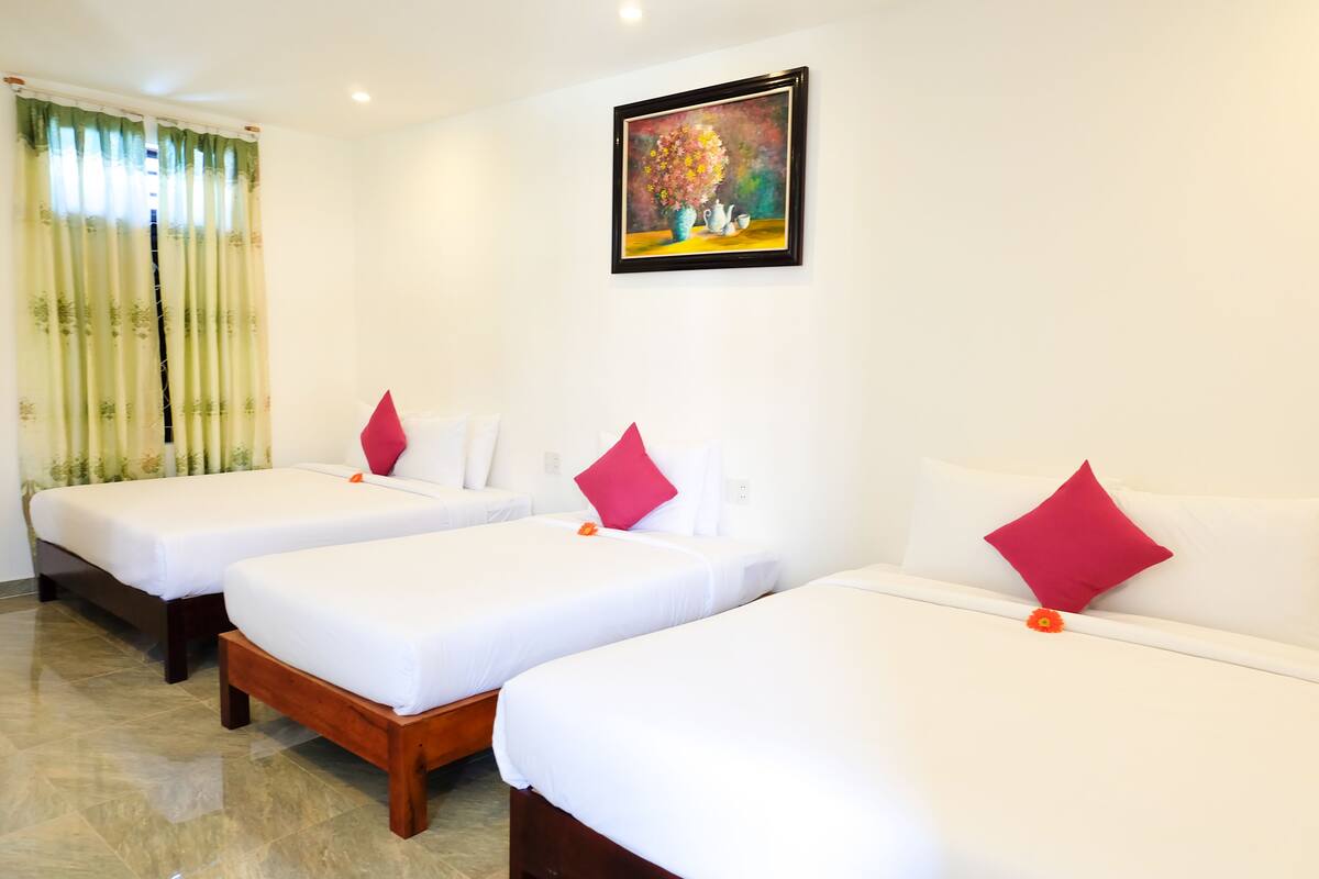 Triple Room, Pool View | Minibar, in-room safe, desk, blackout drapes