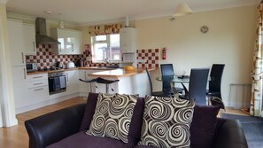 Luxury Cabin, 3 Bedrooms | Living area | Flat-screen TV