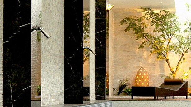 A modern indoor pool area with a seating area, a water feature, and a potted plant. - All-Ur Boutique Motel - Yi-Lan Branch (Yilan)