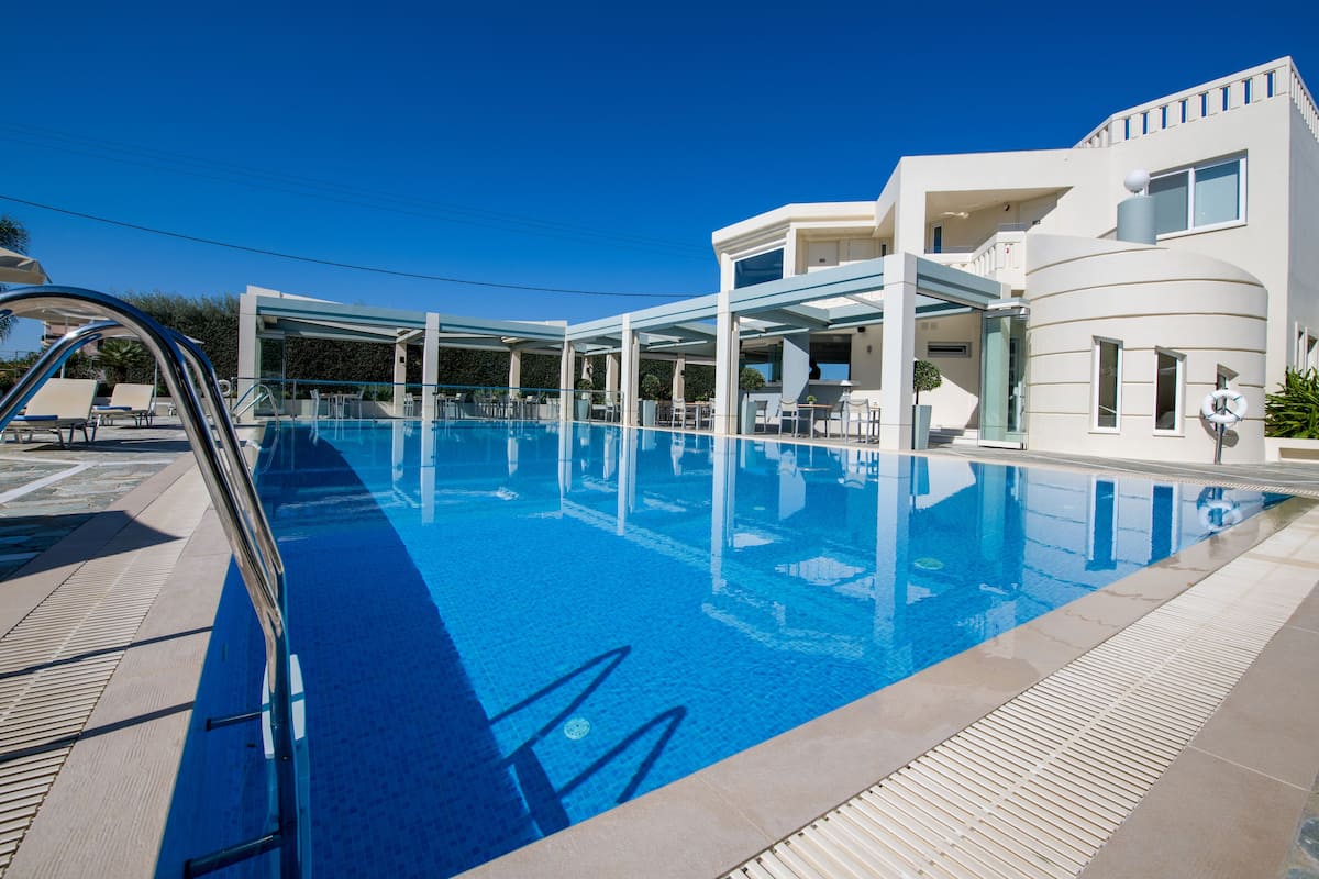 outdoor pool, open 11:00 am to 7:00 pm, pool umbrellas, pool loungers