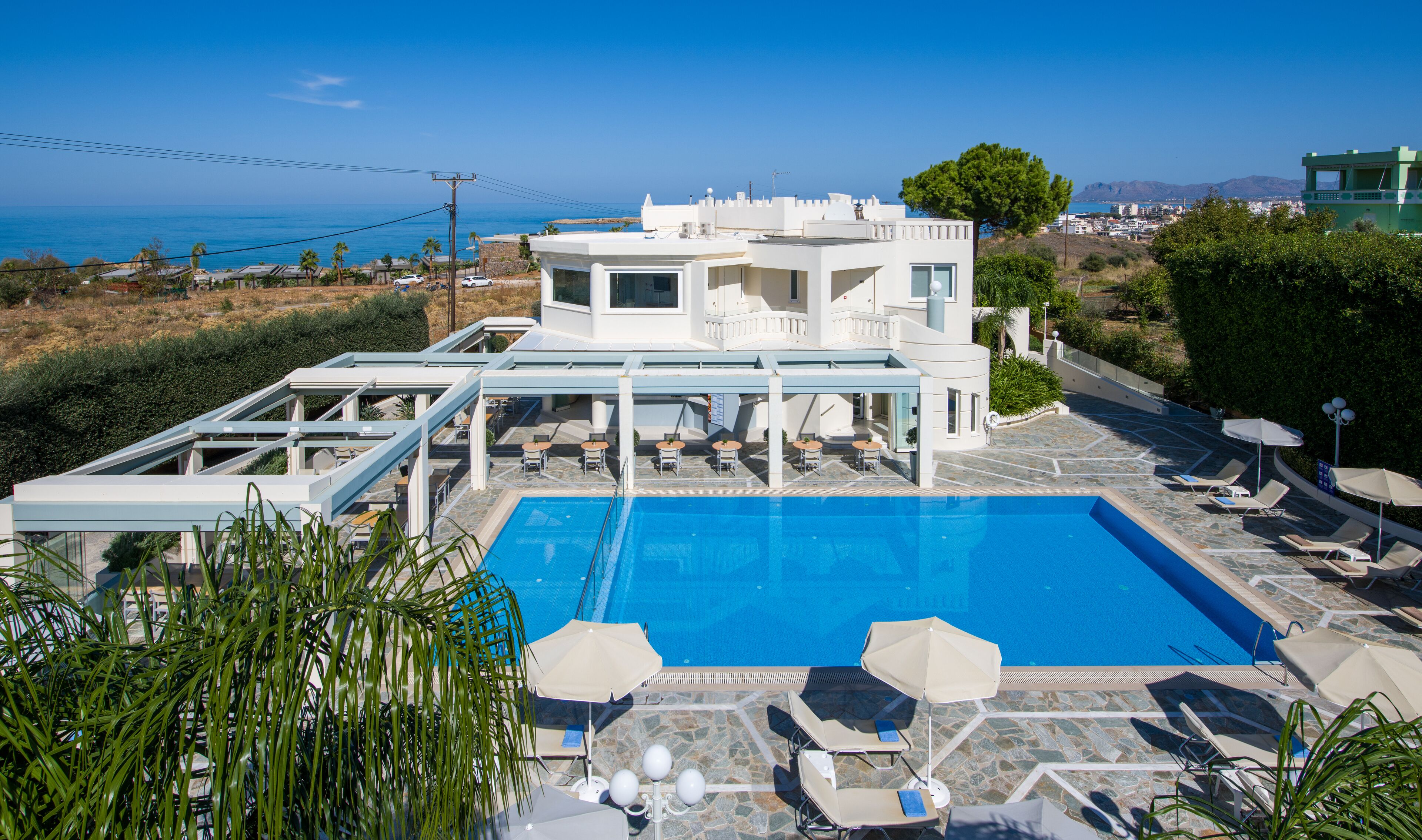 outdoor pool, open 11:00 am to 7:00 pm, pool umbrellas, pool loungers