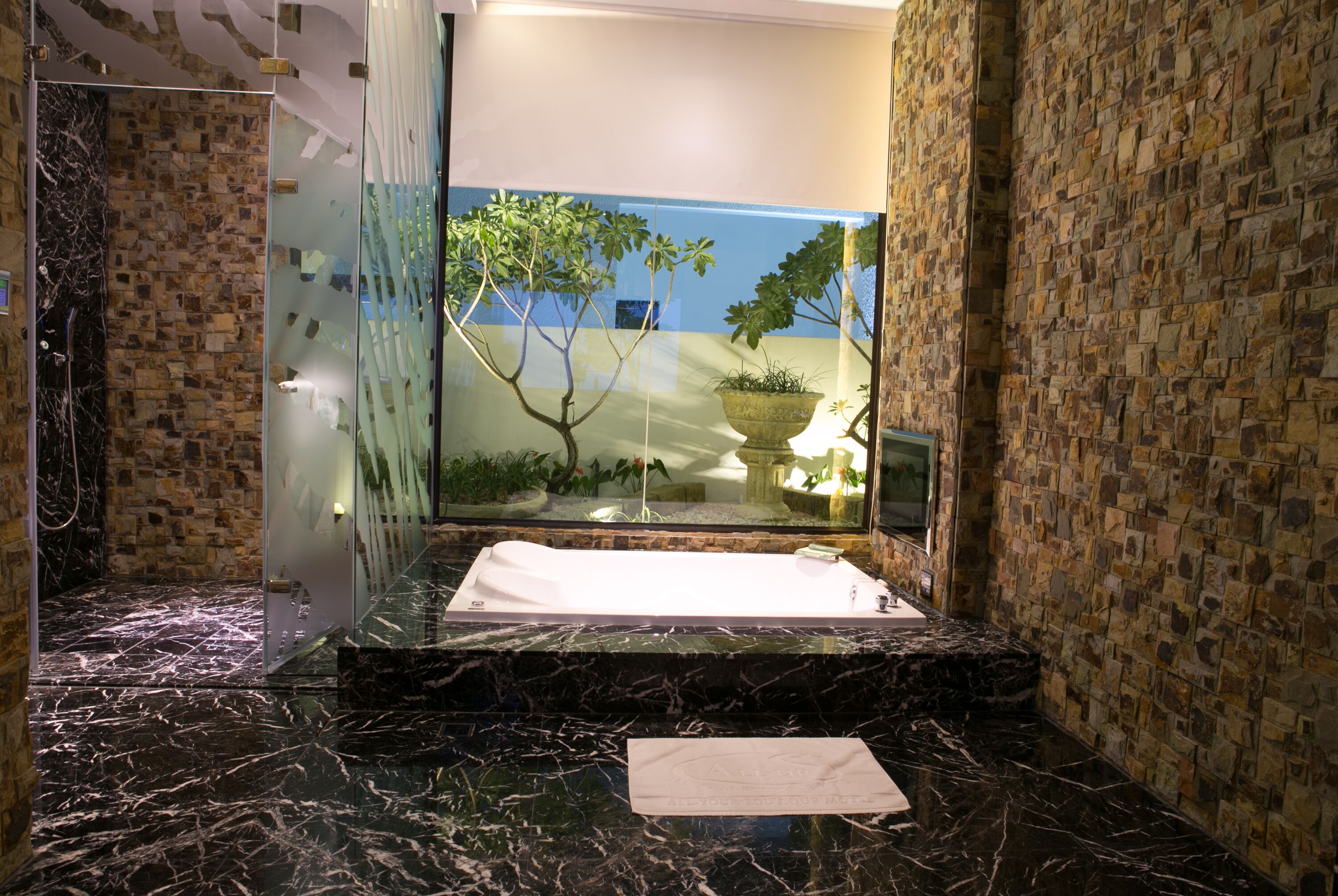 flagship suite (check in time starts from 6pm) | bathroom | separate bathtub and shower, free toiletries, hair dryer, slippers