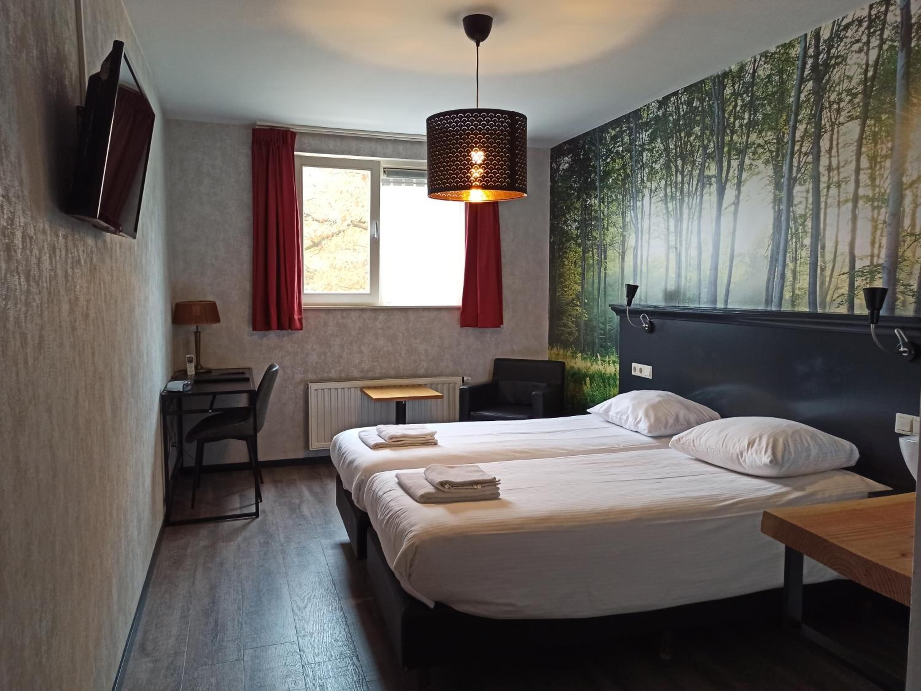 desk, laptop workspace, blackout curtains, cots/infant beds