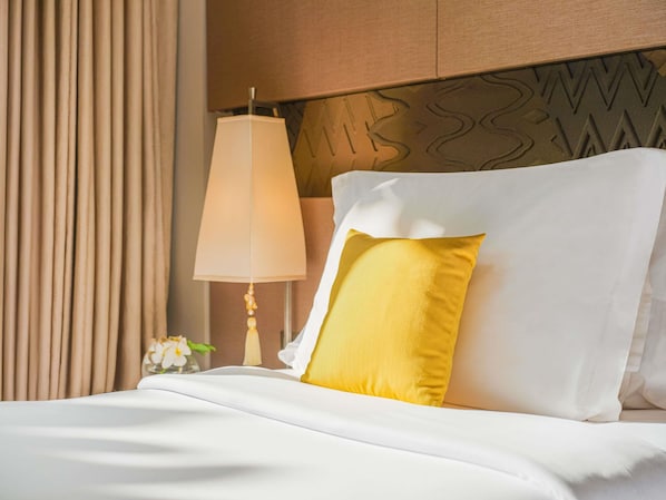 Down comforters, pillowtop beds, in-room safe, desk